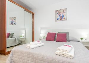Posteľ alebo postele v izbe v ubytovaní Apart-rent Apartament Av Rhode 1º 2009 + 17 fotografií