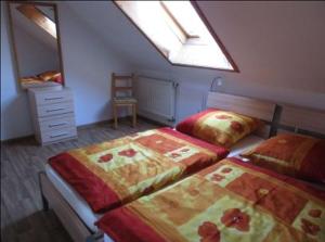 Кровать или кровати в номере Ferienwohnung Wiggermann