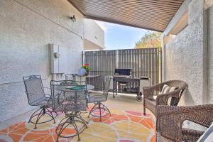 a patio with chairs and a table on a rug at Guest House with Hot Tub 11 Mi to Downtown Phoenix in Phoenix