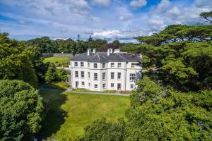 an aerial view of a large white house at Liss Ard Estate in Skibbereen