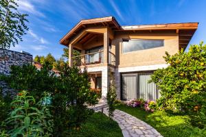 a house with a walkway in front of it at Volans Suites Villas in Fethiye