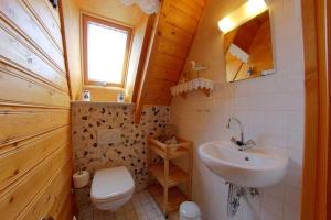 a small bathroom with a sink and a toilet at Strandvogt 2 NT13 in Dorum Neufeld