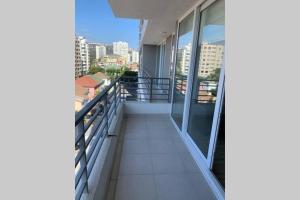 a balcony of a building with a view of a city at Arriendo departamento excelente ubicación por día in Viña del Mar