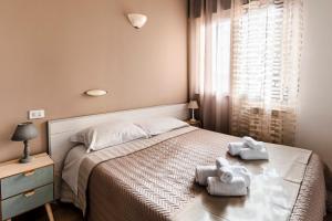 A bed or beds in a room at New Inn Residence