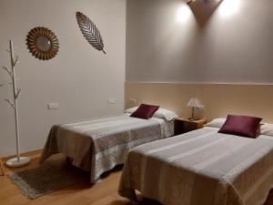 A bed or beds in a room at Ultreia