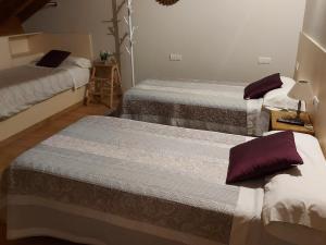 A bed or beds in a room at Ultreia