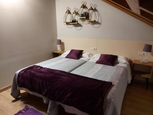 A bed or beds in a room at Ultreia