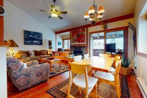 a living room with a wooden table and a couch at 1123 Indian Paintbrush in Wilson