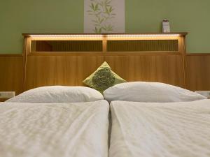 Postel nebo postele na pokoji v ubytování Pension Wienerstub'n