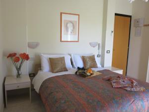 a bedroom with a large bed with flowers on it at Stella del Mare in Sottomarina