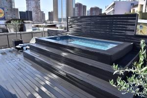 a hot tub on top of a building at Edificio Nueva Bueras in Santiago