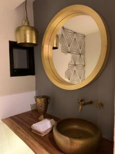 a bathroom with a large mirror and a sink at Casa Martha hotel boutique in Tequisquiapan +98 photos