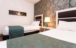 A bed or beds in a room at Turkuaz Suites Bosphorus