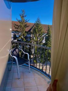 a balcony with a chair on a balcony at Hotel Condes De Lemos España in Monforte de Lemos