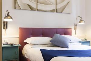 Ένα ή περισσότερα κρεβάτια σε δωμάτιο στο B&B Prestigia Rooms