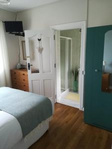 Postel nebo postele na pokoji v ubytování Greystone House