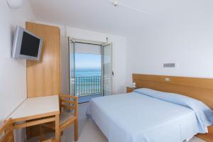 Voodi või voodid majutusasutuse Albergo La Sirenella toas