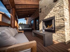 A seating area at Estes Escape - Jacuzzi, Indoor Outdoor Fireplace, Perfect Location!
