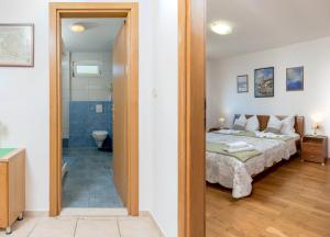 Postel nebo postele na pokoji v ubytování Apartmani Putnik