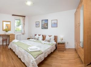 Postel nebo postele na pokoji v ubytování Apartmani Putnik