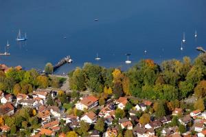 an aerial view of a town next to a body of water at Hotel Gasthof Seefelder Hof in Dießen am Ammersee