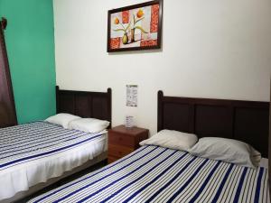 Cama o camas de una habitación en Hotel y Restaurante Las Gardenias