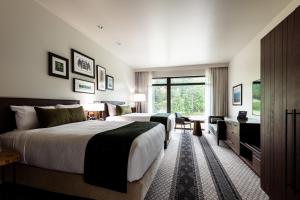 A bed or beds in a room at 7 Cedars Hotel & Casino