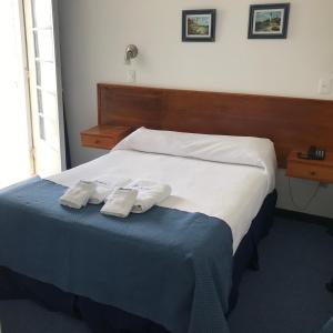 Voodi või voodid majutusasutuse Hotel Escorial toas