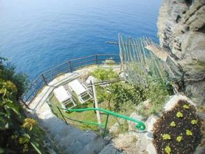 a view of a water slide on the side of a cliff at Hotel Gianni Franzi in Vernazza