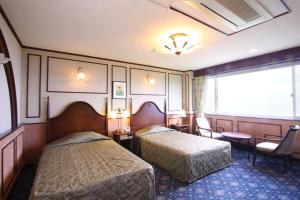 Cama ou camas em um quarto em Shiretoko Daiichi Hotel