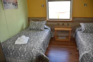 Uma cama ou camas num quarto em Asói Hostal