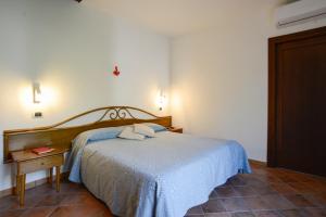 Ένα ή περισσότερα κρεβάτια σε δωμάτιο στο Agriturismo Piccolo Canyon