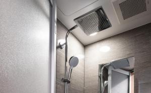 a bathroom with a shower with a shower head at Hotel Vista Osaka Namba in Osaka