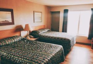 Katil atau katil-katil dalam bilik di Hi Valley Motor Inn