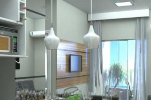 a kitchen with two pendant lights and a dining room at Apartamento em Salinas Exclusive Resort in Salinópolis