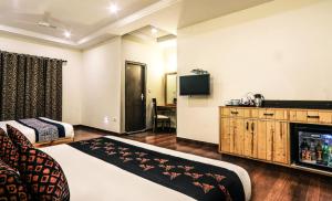 TV o dispositivi per l'intrattenimento presso Hotel SunGrace