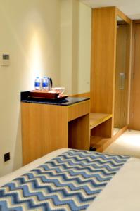 Cama o camas de una habitación en Louis Kienne Hotel Simpang Lima