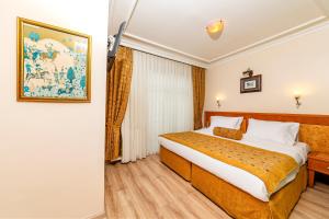 Postel nebo postele na pokoji v ubytování Santa Ottoman Hotel