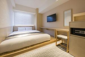 Postel nebo postele na pokoji v ubytování IAM HOTEL