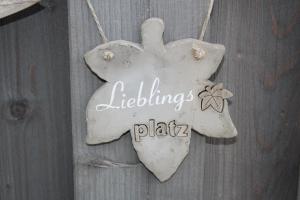 Ein Zertifikat, Auszeichnung, Logo oder anderes Dokument, das in der Unterkunft Ferienwohnungen im Haus Strandburg Grömitz ausgestellt ist