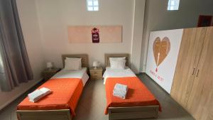 Postel nebo postele na pokoji v ubytování Patras Juliet House