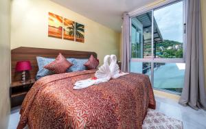 a bedroom with a bed with white shoes on it at Dreambeach 2-villas in Panwa Beach +43 photos