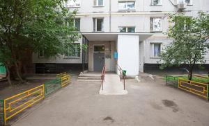 a building with a gate and a building at Business Brusnika Apartment Serpukhovskaya in Moscow