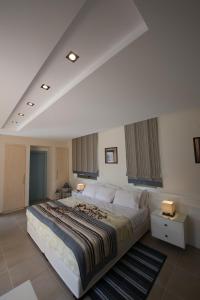 Postel nebo postele na pokoji v ubytování Mantinia Bay Hotel + 36 fotografií