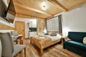 Posteľ alebo postele v izbe v ubytovaní Najlepszy Widok apartamenty