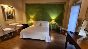 Postel nebo postele na pokoji v ubytování Hotel Piazza Vecchia