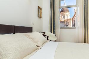 Postel nebo postele na pokoji v ubytování Apartments Placa Dubrovnik