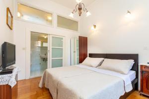 Postel nebo postele na pokoji v ubytování Apartments Placa Dubrovnik