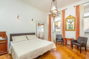 En eller flere senge i et værelse på Apartments Placa Dubrovnik