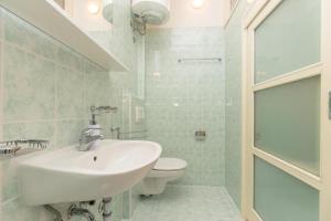 a bathroom with a sink and a toilet at Apartments Placa Dubrovnik in Dubrovnik